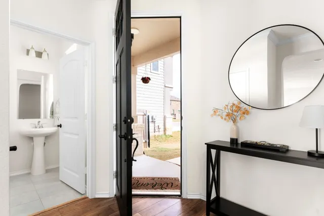 a view of a mirror from a hallway