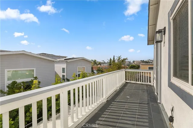 a view of a balcony with wooden floor