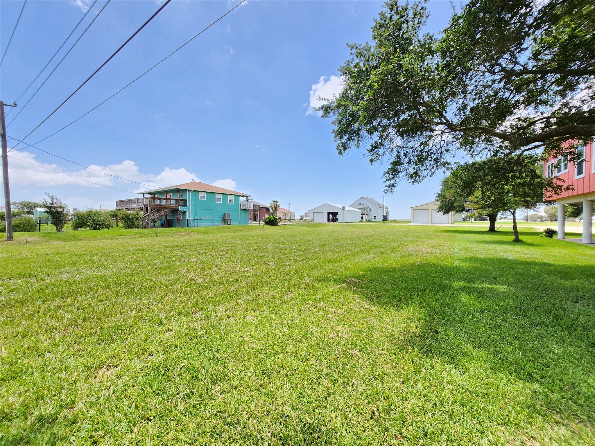 853 Swallow Drive Palacios, TX 77465 - Photo 12 of 20 a view of a green field with sitting area