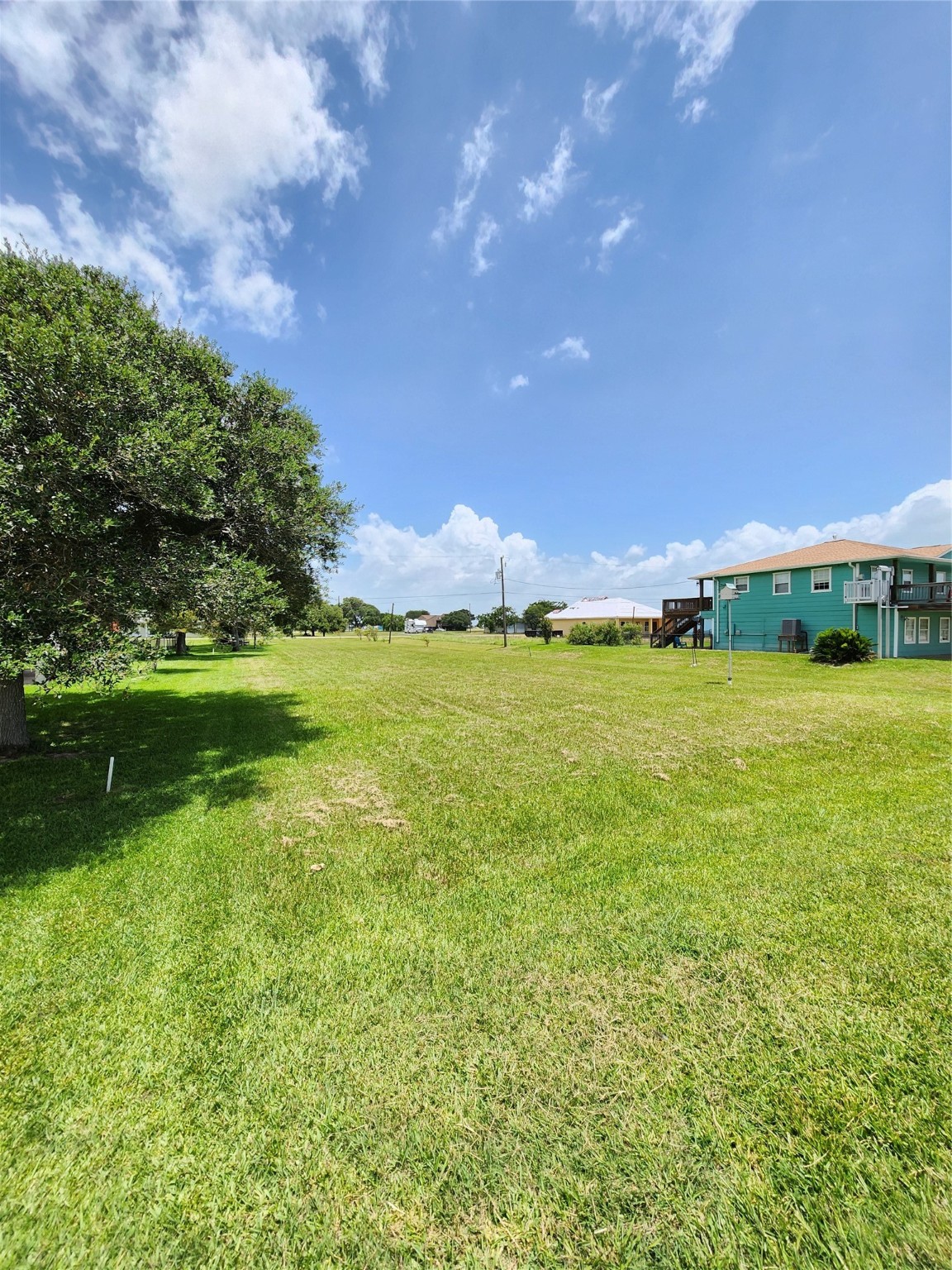 853 Swallow Drive Palacios, TX 77465 - Photo 15 of 20 a backyard of a house with a yard and outdoor seating