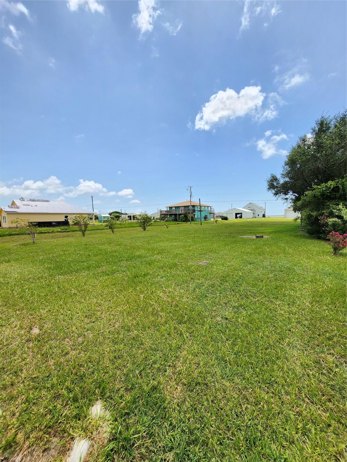 853 Swallow Drive Palacios, TX 77465 - Photo 3 of 20 a view of a big yard with an outdoor space and seating