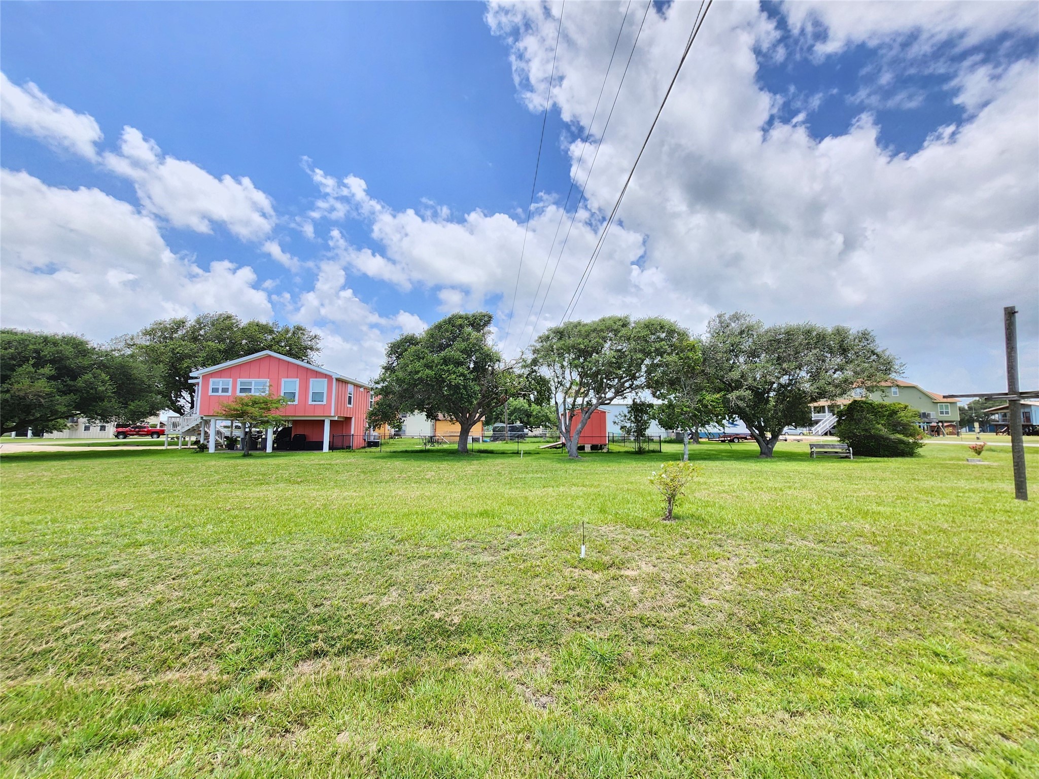 853 Swallow Drive Palacios, TX 77465 - Photo 10 of 20 a view of a house with a big yard and potted plants