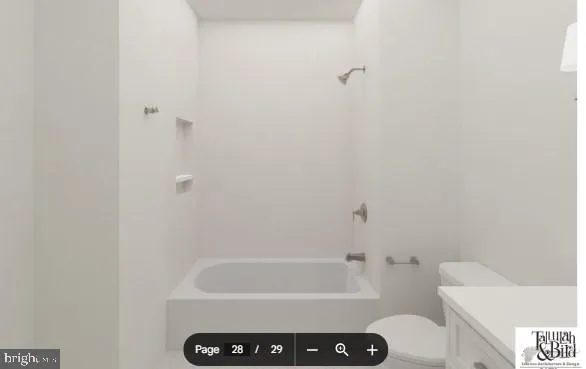 a bathroom with a bathtub and a toilet