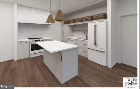 a kitchen with a stove and a refrigerator