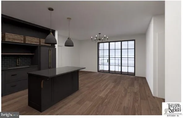 a kitchen view with wooden floor and a fireplace