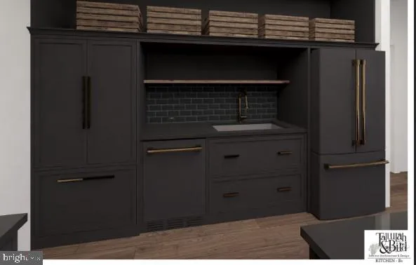 a kitchen with a sink and cabinets