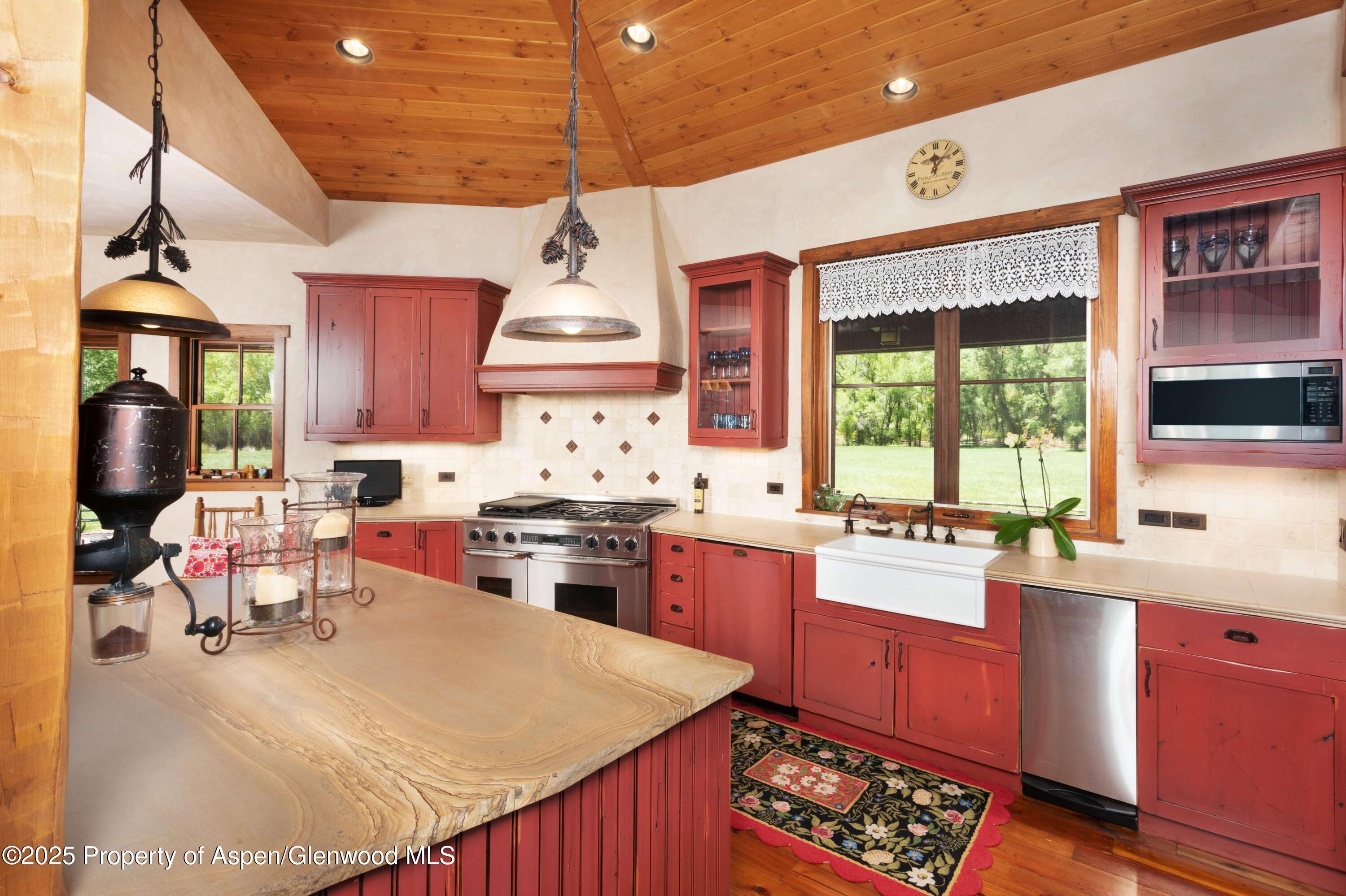 5548 Frying Pan Road Basalt, CO 81621 - Photo 11 of 53 a kitchen with a stove a refrigerator and a sink