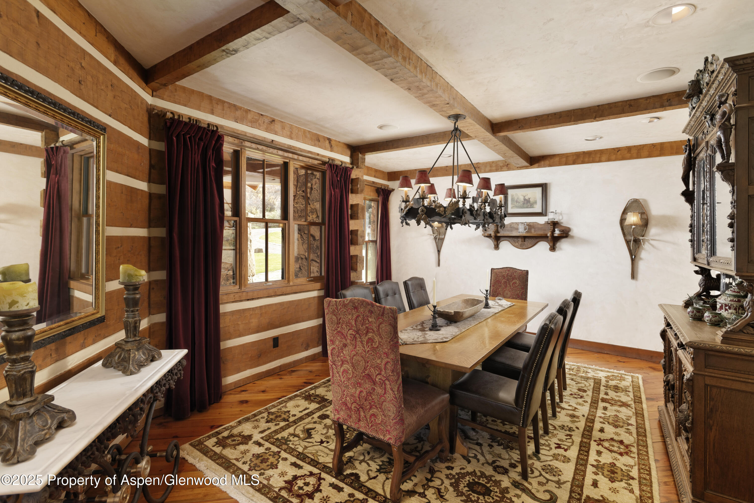 5548 Frying Pan Road Basalt, CO 81621 - Photo 13 of 53 a dining room with furniture a chandelier and wooden floor