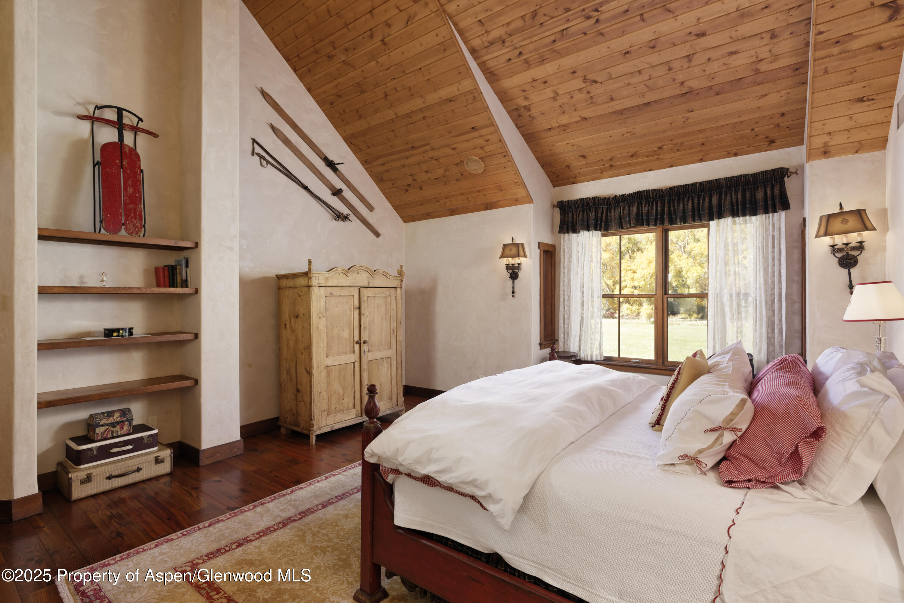 5548 Frying Pan Road Basalt, CO 81621 - Photo 16 of 53 a bedroom with a bed a window and painting on the wall