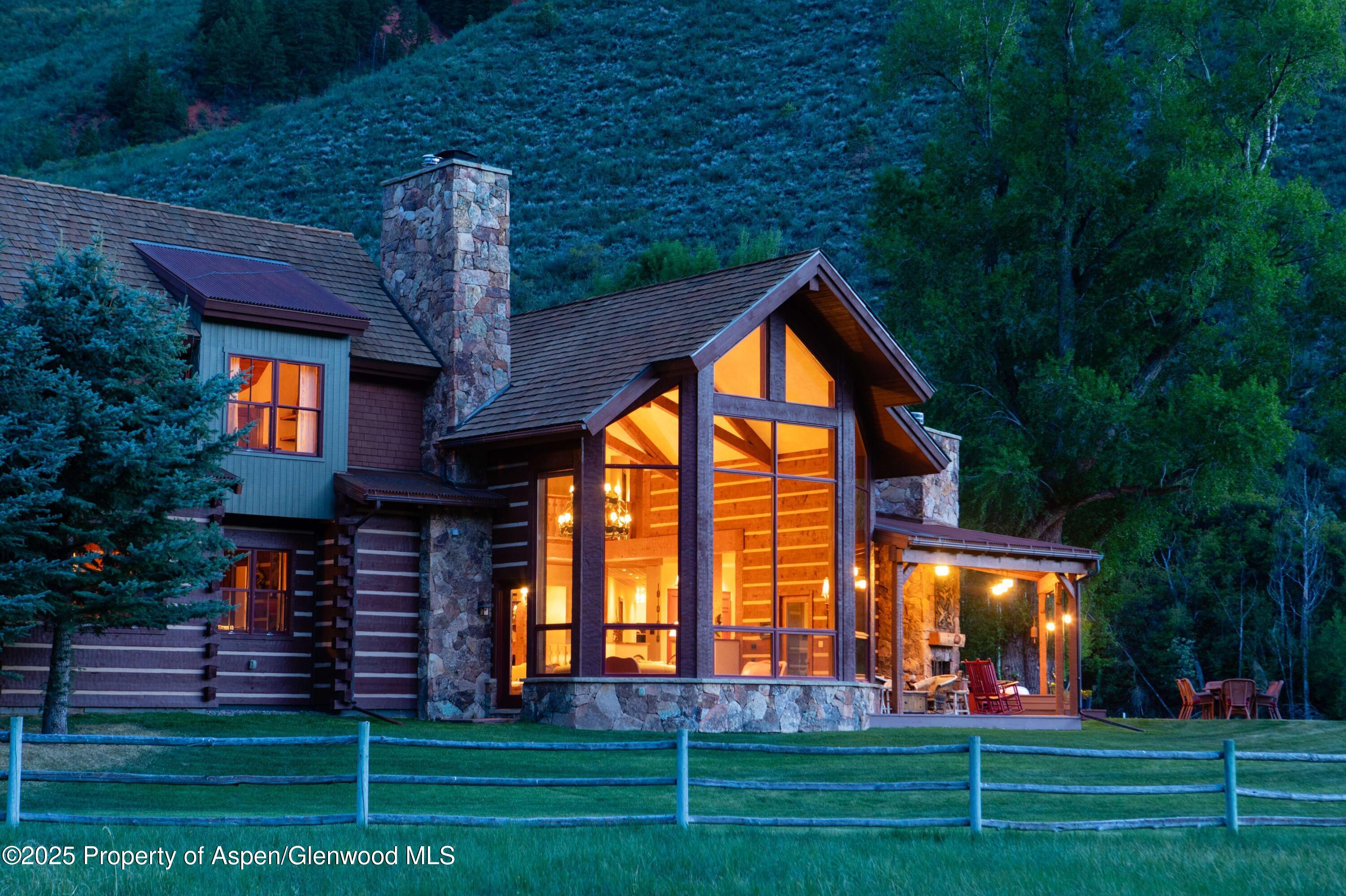 5548 Frying Pan Road Basalt, CO 81621 - Photo 2 of 53 a front view of a house with a yard