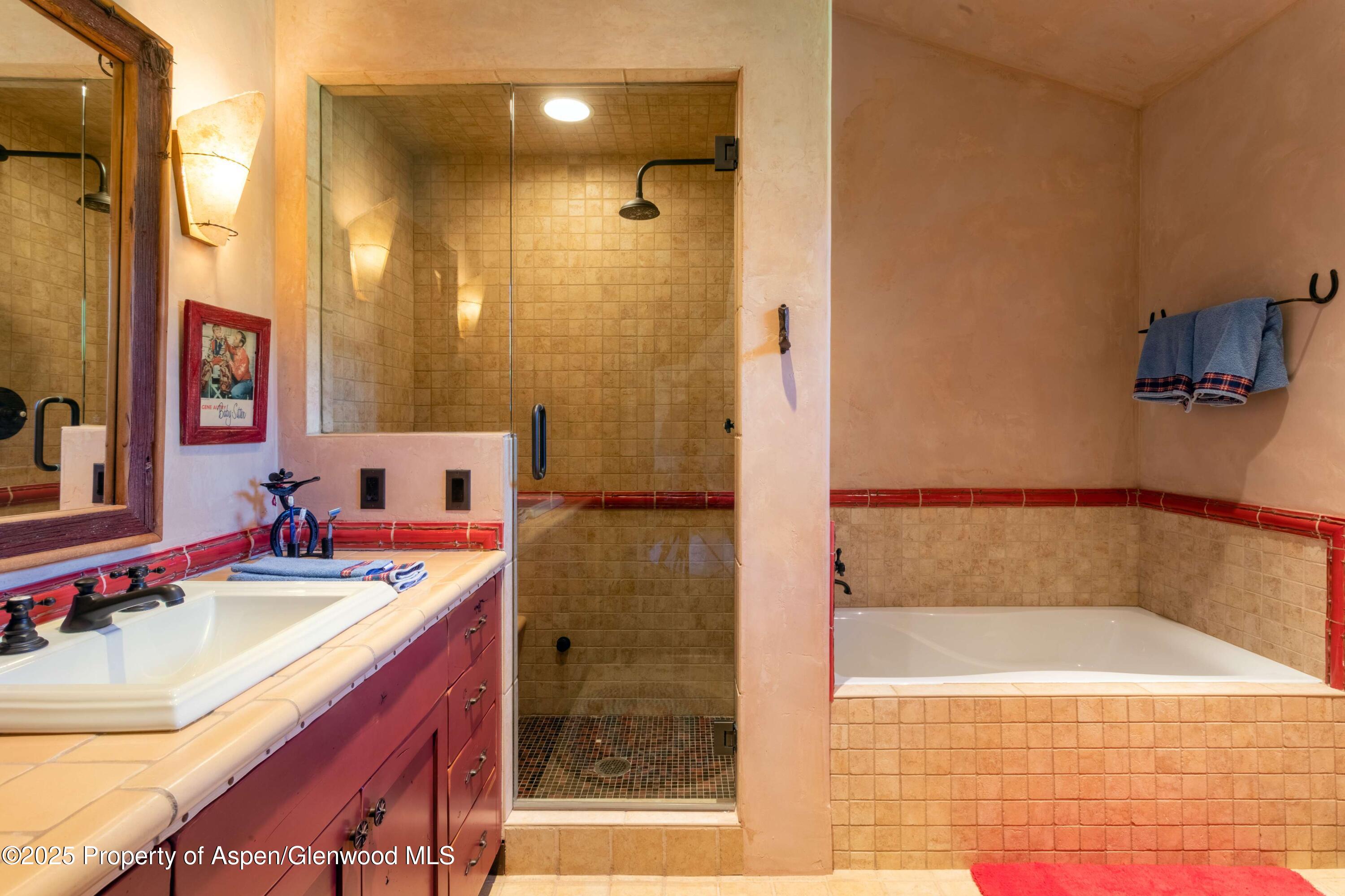 5548 Frying Pan Road Basalt, CO 81621 - Photo 21 of 53 a bathroom with a tub sink vanity granite and shower