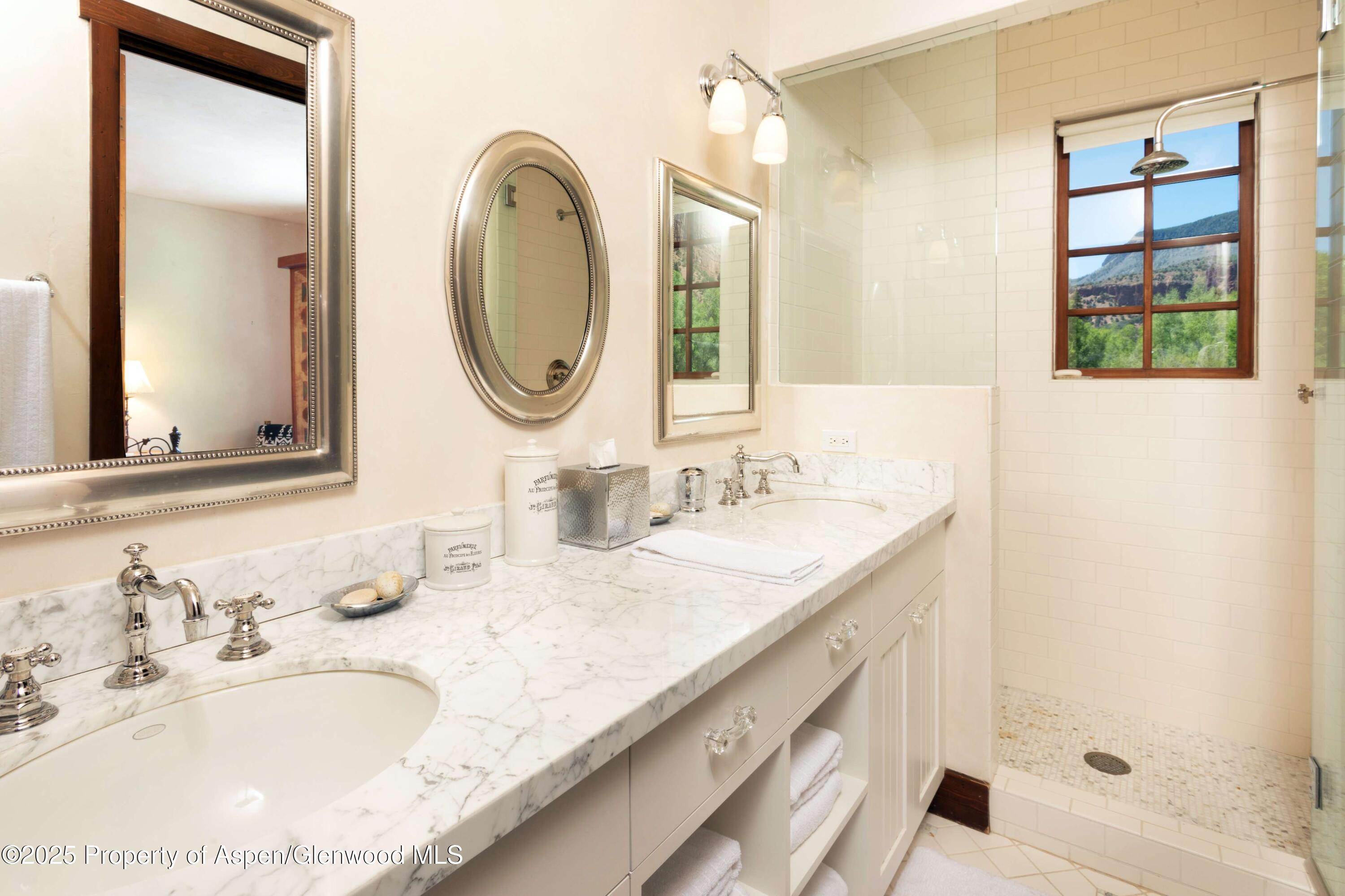 5548 Frying Pan Road Basalt, CO 81621 - Photo 23 of 53 a bathroom with a granite countertop double vanity sink and a mirror