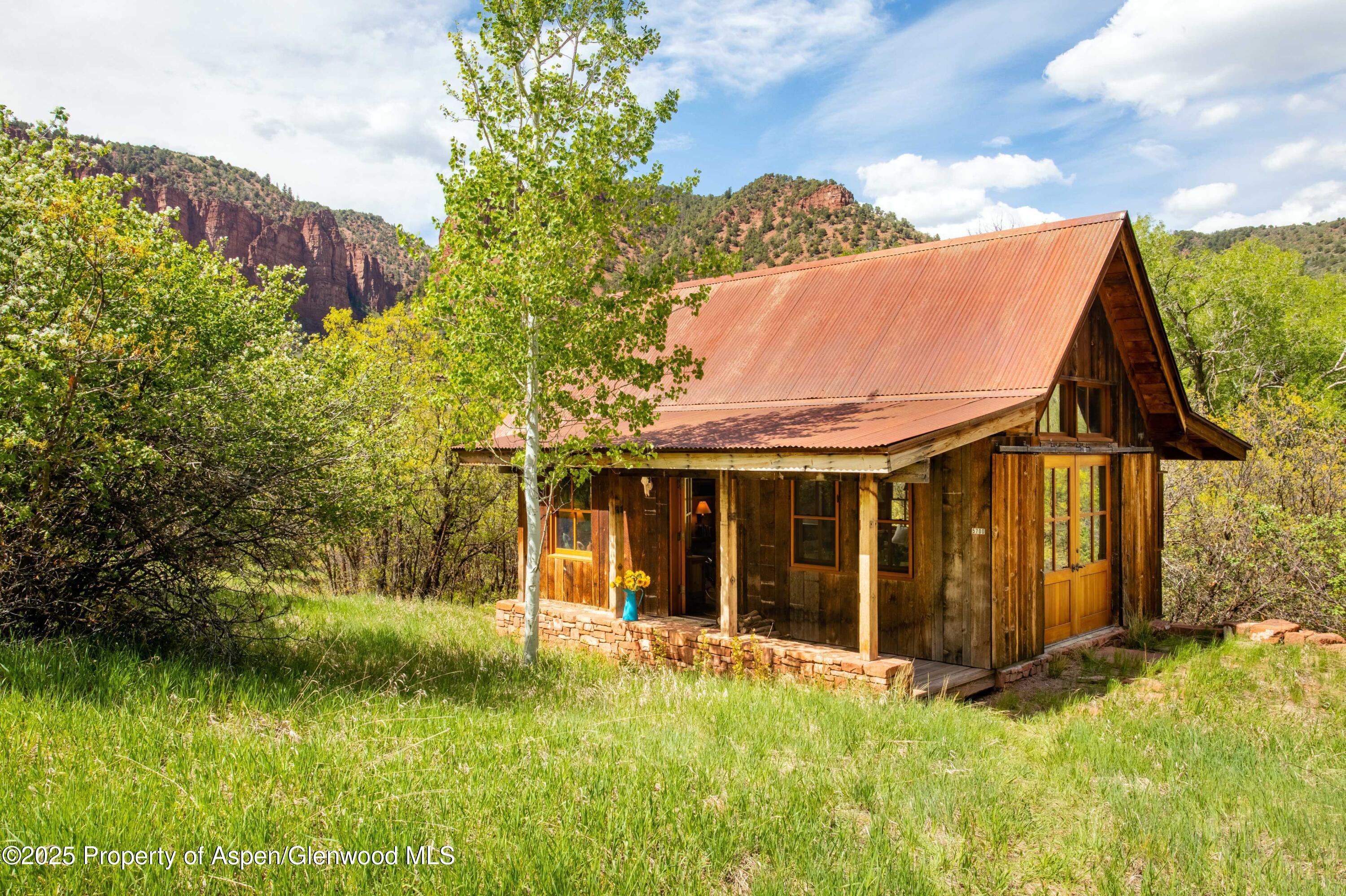 5548 Frying Pan Road Basalt, CO 81621 - Photo 29 of 53 a view of a house with a garden