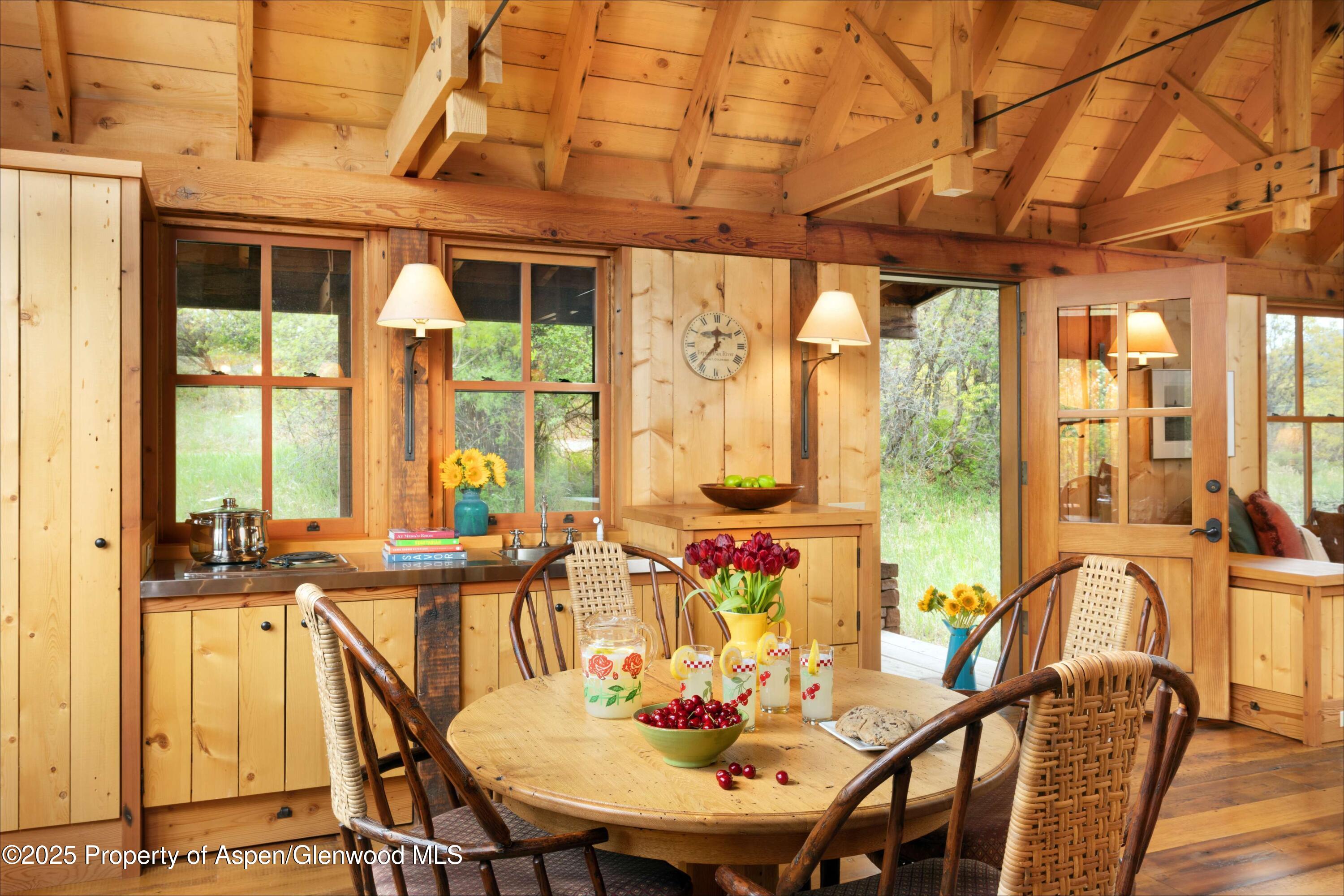 5548 Frying Pan Road Basalt, CO 81621 - Photo 33 of 53 a view of a dining room with furniture window and outside view