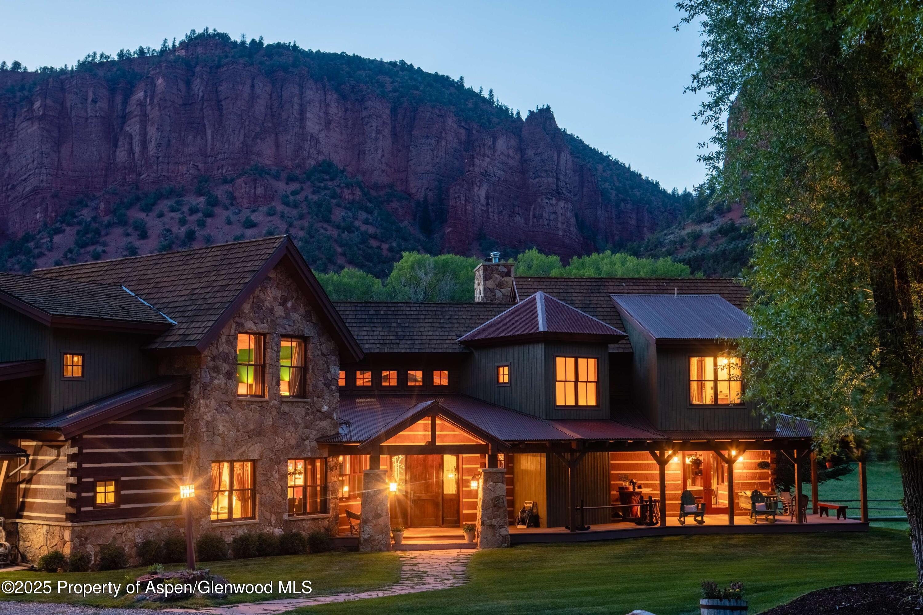 5548 Frying Pan Road Basalt, CO 81621 - Photo 48 of 53 a front view of a house with a yard
