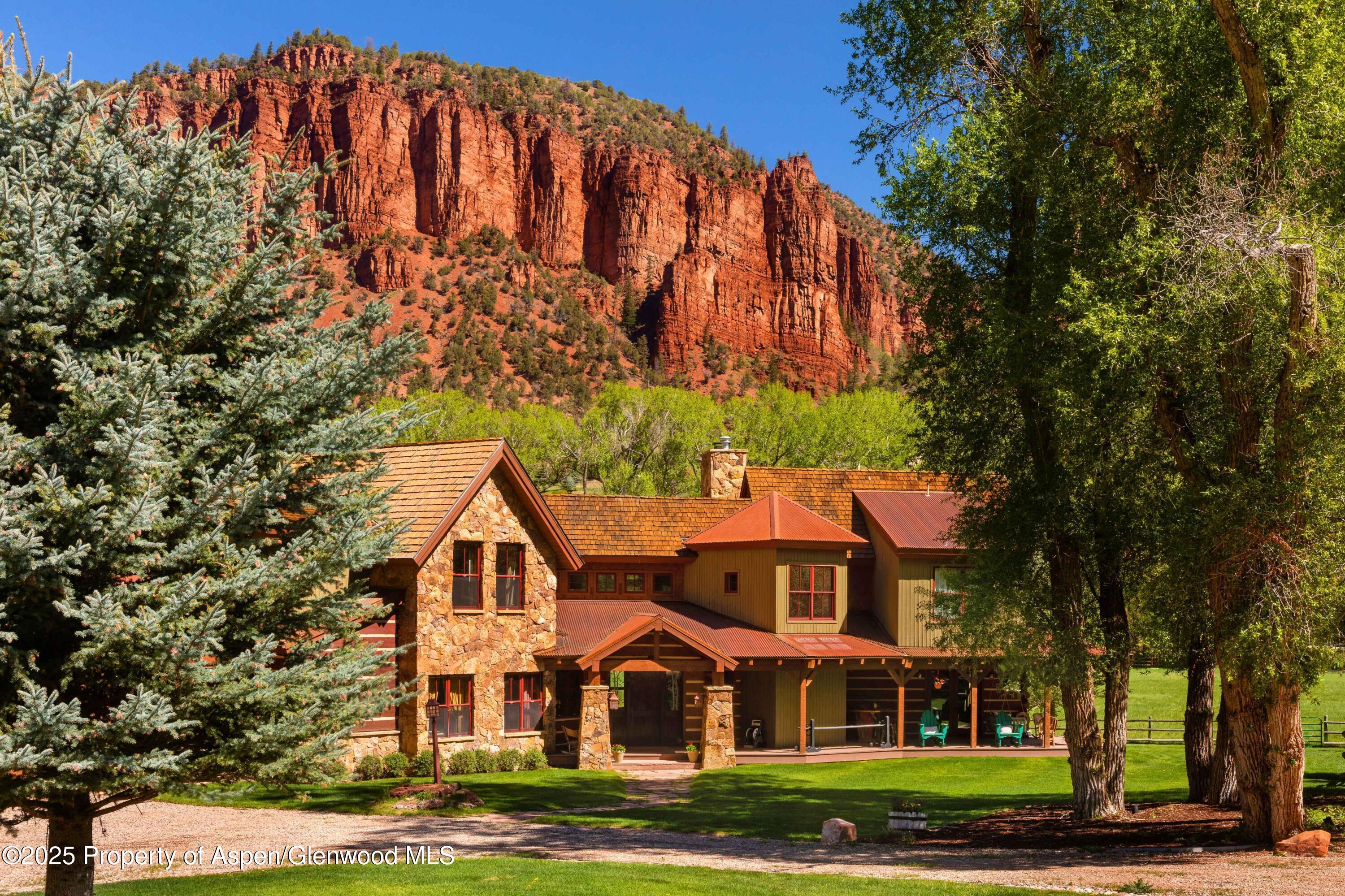 5548 Frying Pan Road Basalt, CO 81621 - Photo 7 of 53 a front view of a house with a garden