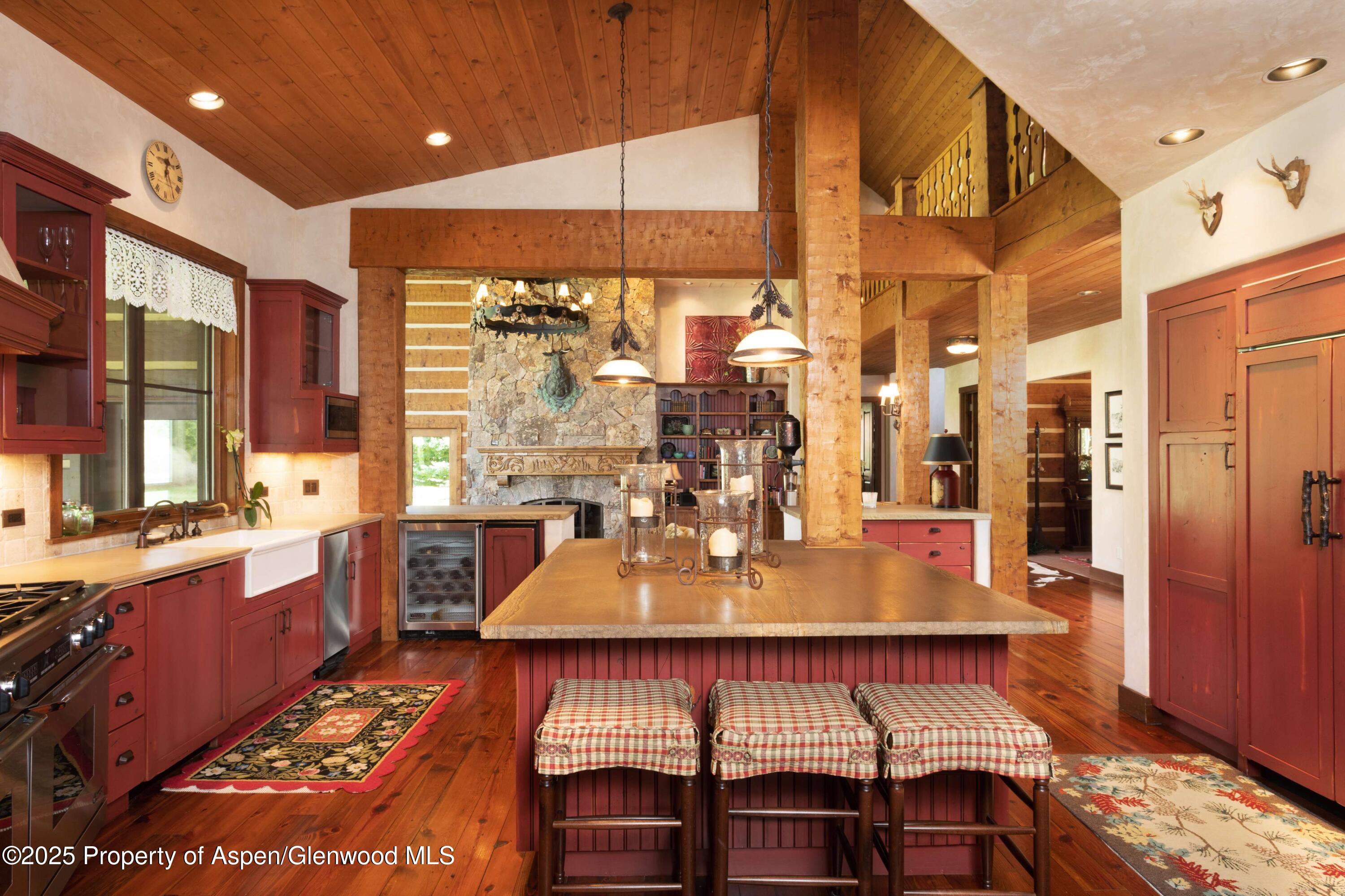 5548 Frying Pan Road Basalt, CO 81621 - Photo 10 of 53 a view of a dining room with furniture a chandelier and wooden floor