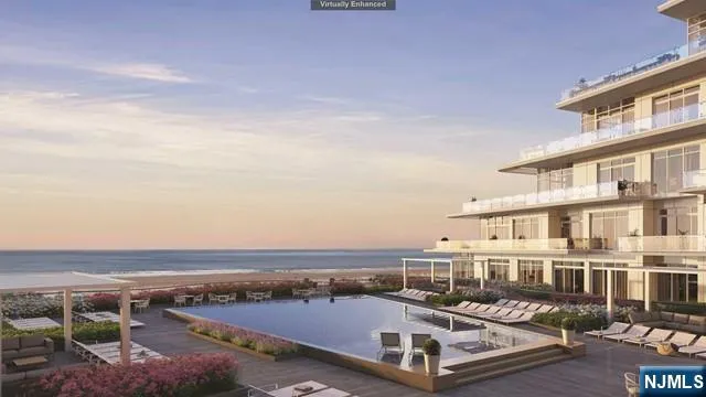 an aerial view of a swimming pool and lake view