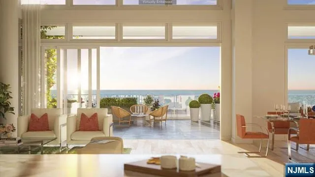 a living room with fireplace furniture and floor to ceiling window