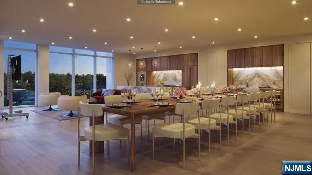 a view of a dining room with furniture a kitchen and a projector