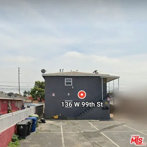 a view of a street with a building in the background