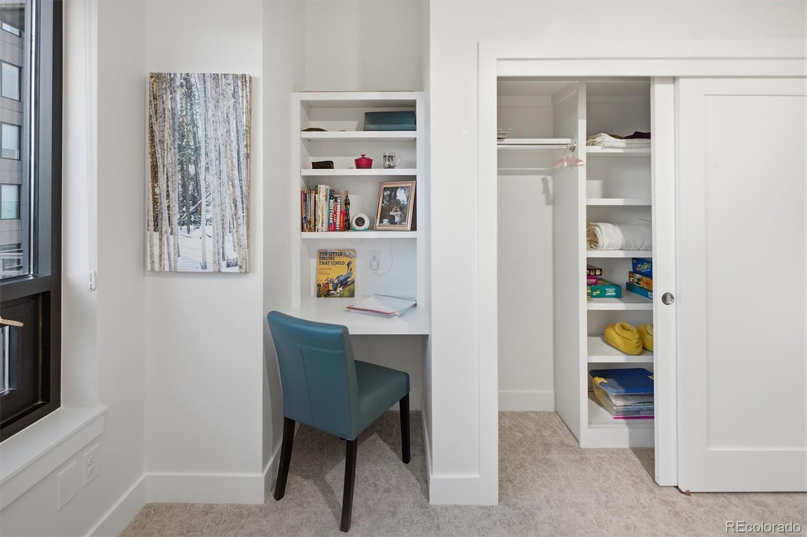 1650 Fillmore Street, Unit 1107 Denver, CO 80206 - Photo 22 of 49 a workspace with furniture and closet