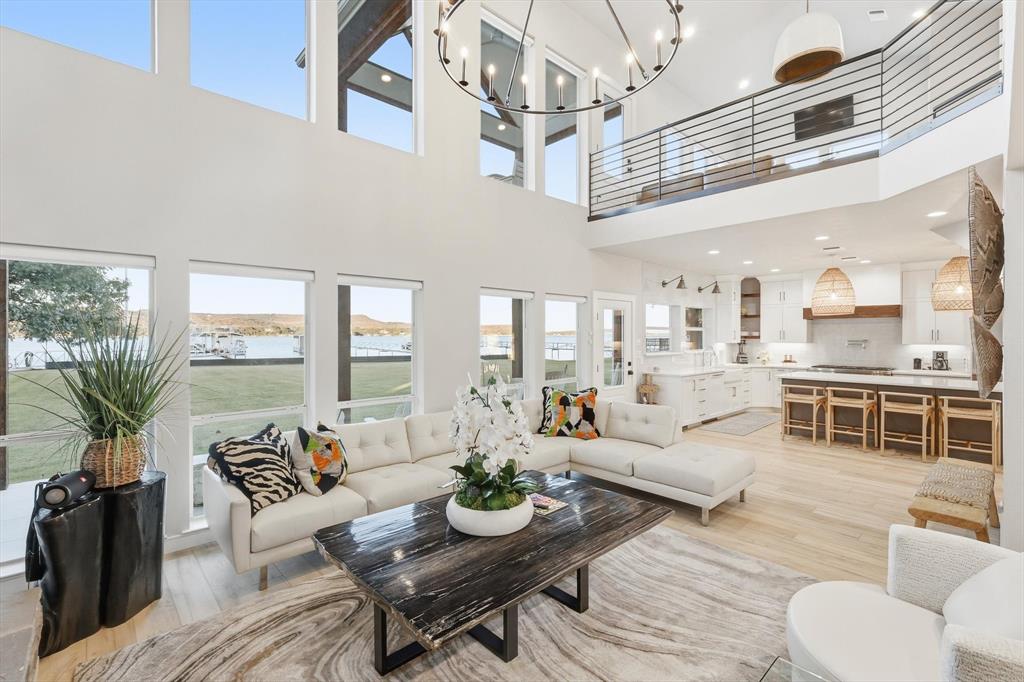 2285 Sage Circle Graford, TX 76449 - Photo 16 of 40 a living room with furniture kitchen view and large windows