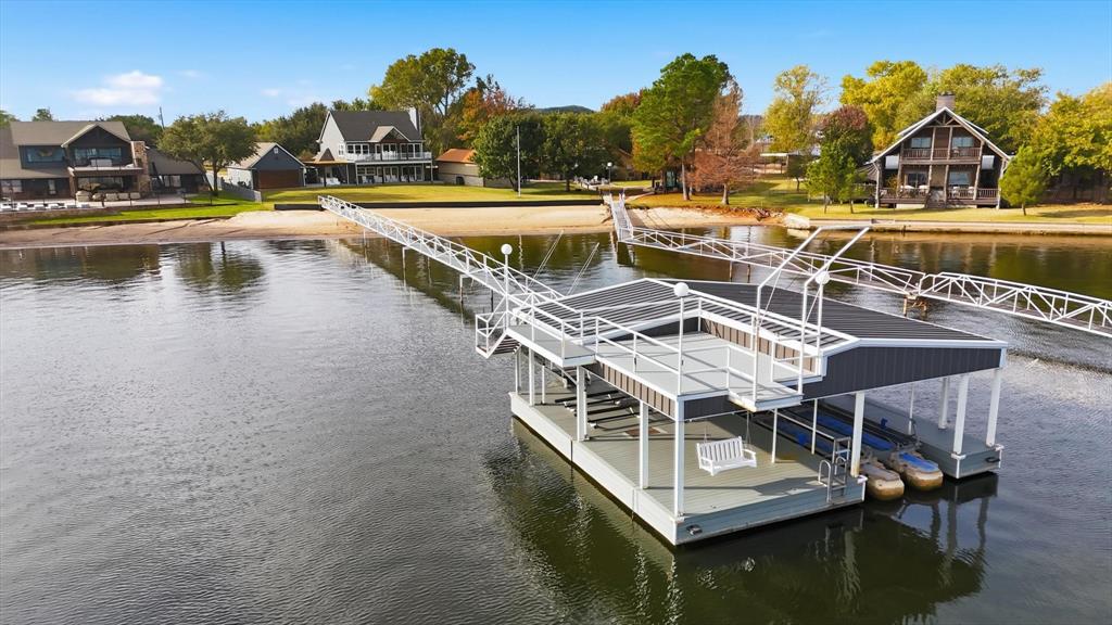 2285 Sage Circle Graford, TX 76449 - Photo 2 of 40 a view of swimming pool with outdoor seating and lake view