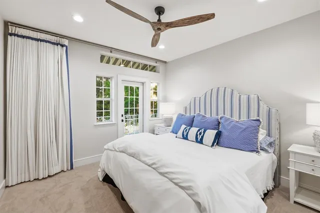 a bathroom with a sink a toilet a mirror and shower