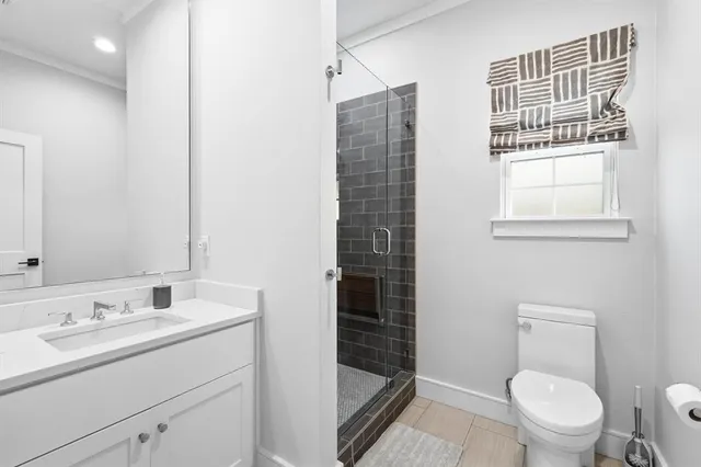 a bedroom with a large bed and a flat screen tv