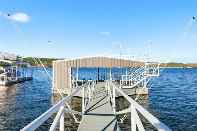 a view of a patio with table and chairs