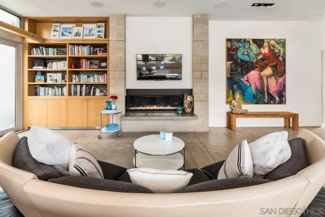 a kitchen with stainless steel appliances kitchen island granite countertop a table and chairs in it