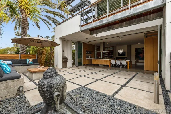 a bedroom with a bed and a painting on the wall