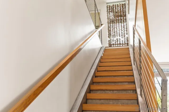 a dining room with furniture a chandelier and a rug