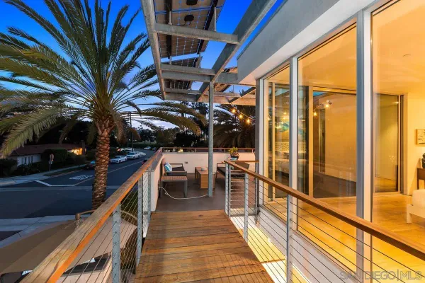 an aerial view of a house with a yard and lake view