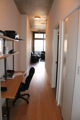 235 West Van Buren Street, Unit 3721 Chicago, IL 60607 - Photo 15 of 17 a view of a workspace with furniture and a window
