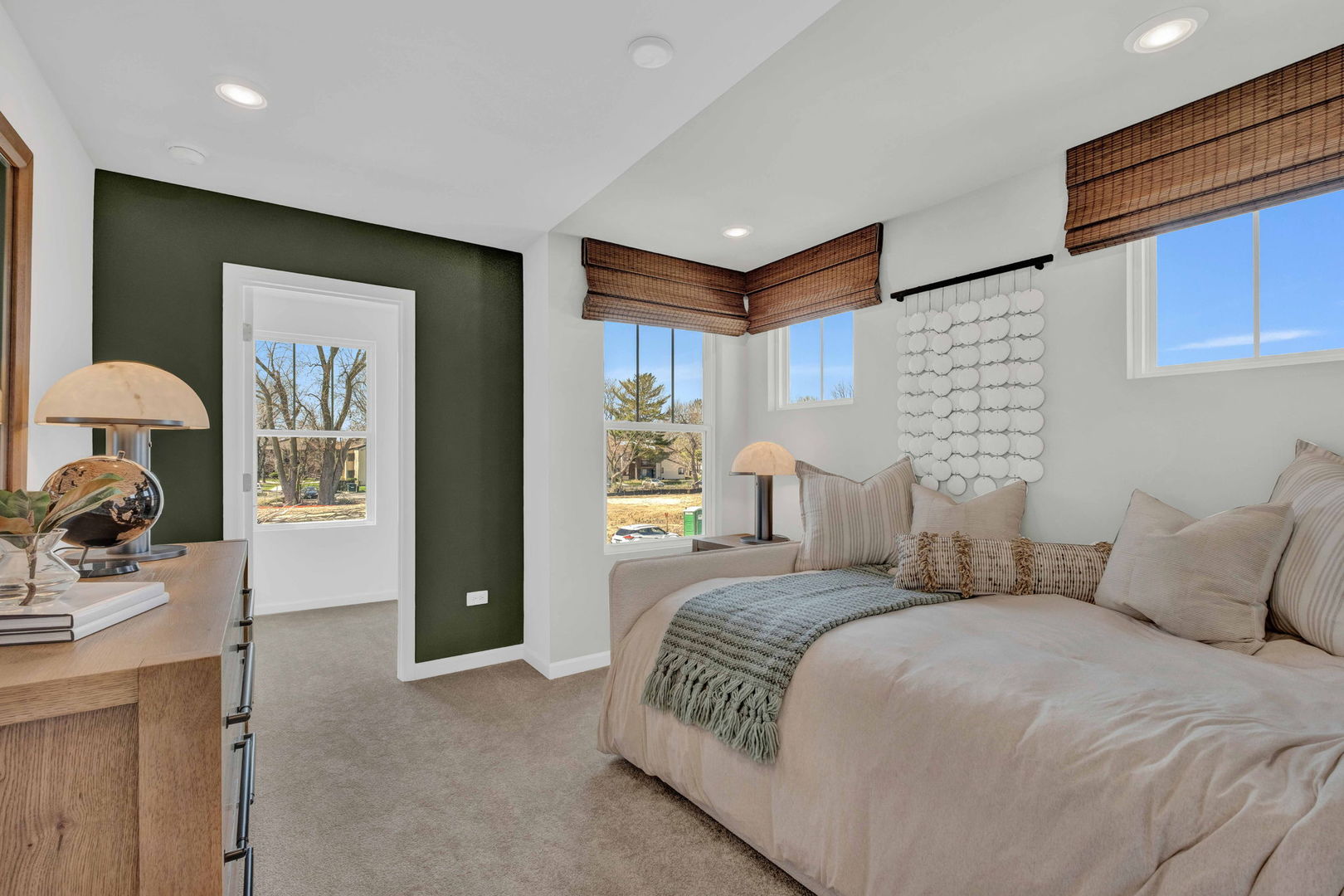 73 Weirich Way, Unit 78003 Batavia, IL 60510 - Photo 20 of 22 a bedroom with a large bed and a chandelier