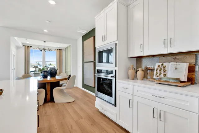 a view of a kitchen with microwave and cabinets