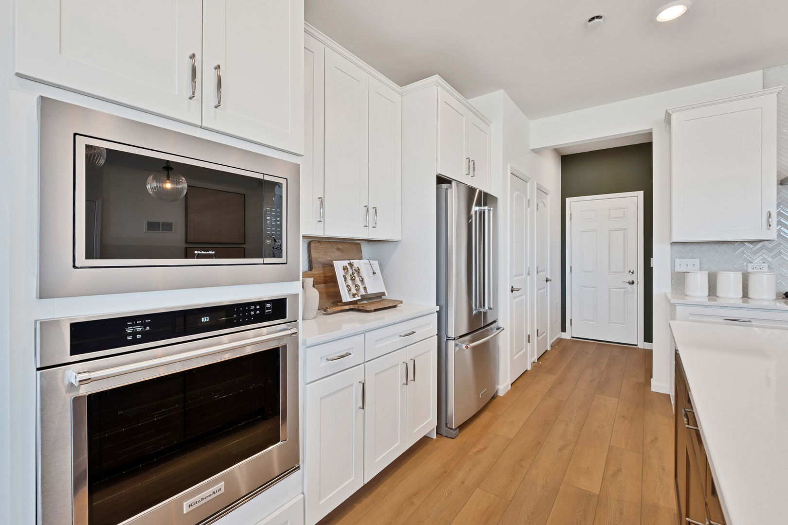 73 Weirich Way, Unit 78003 Batavia, IL 60510 - Photo 9 of 22 a kitchen with stainless steel appliances a stove microwave and refrigerator