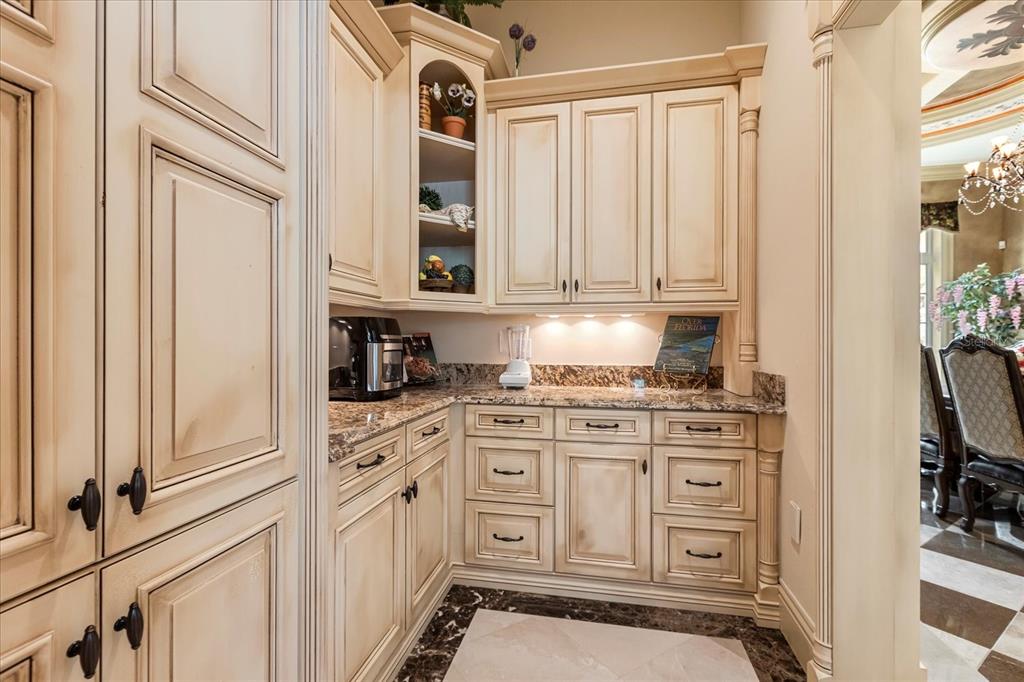 8590 Apache Trail Davenport, FL 33896 - Photo 17 of 100 a kitchen with stainless steel appliances granite countertop a stove and a refrigerator