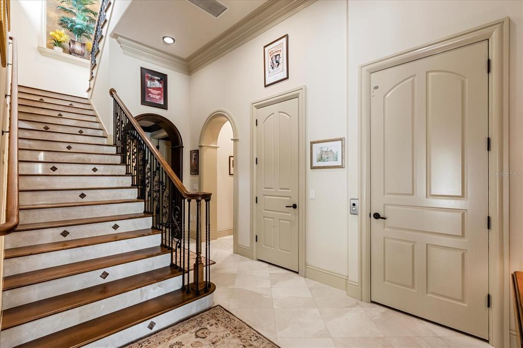8590 Apache Trail Davenport, FL 33896 - Photo 32 of 100 a view of entryway with wooden floor and stairs