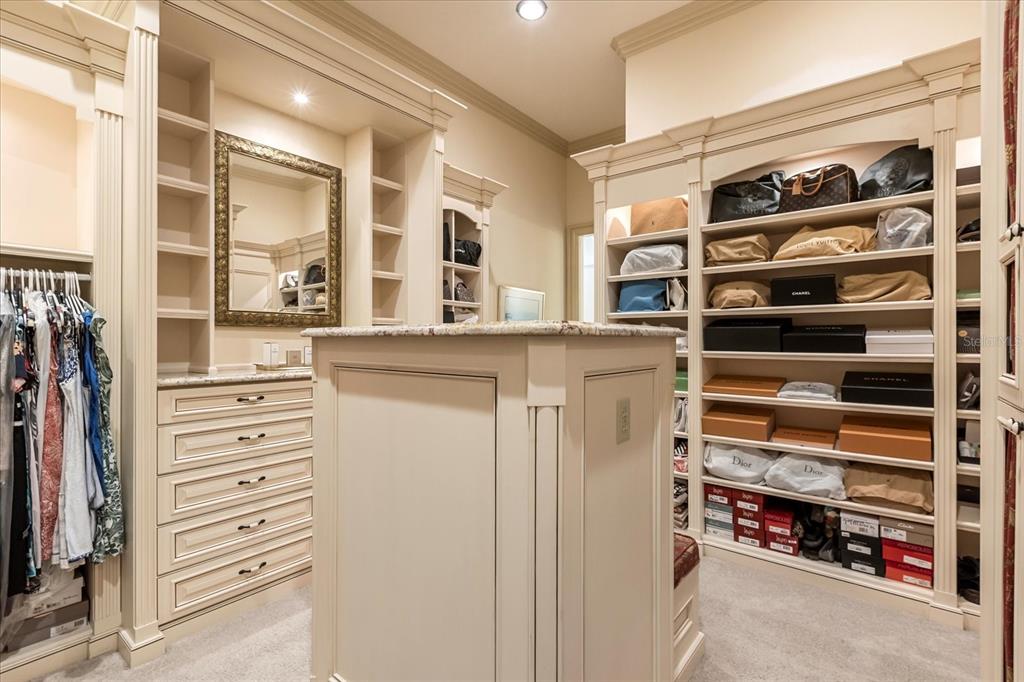 8590 Apache Trail Davenport, FL 33896 - Photo 51 of 100 a view of walk in closet with empty racks