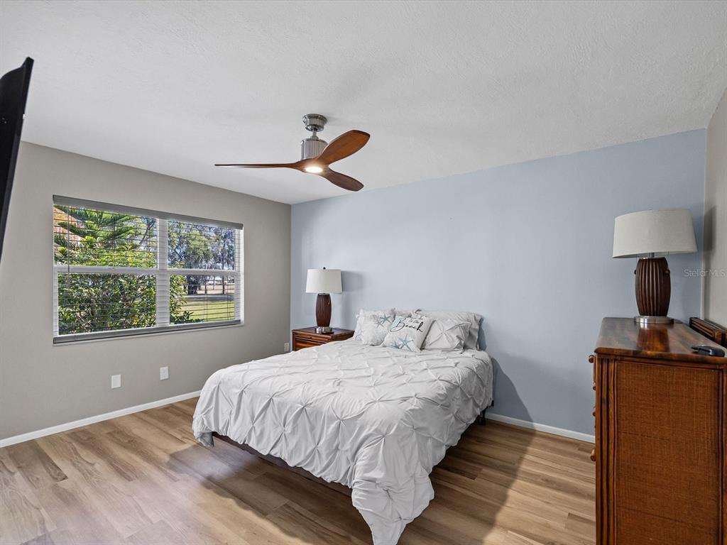 3717 Trophy Boulevard New Port Richey, FL 34655 - Photo 13 of 35 a bedroom with bed and window