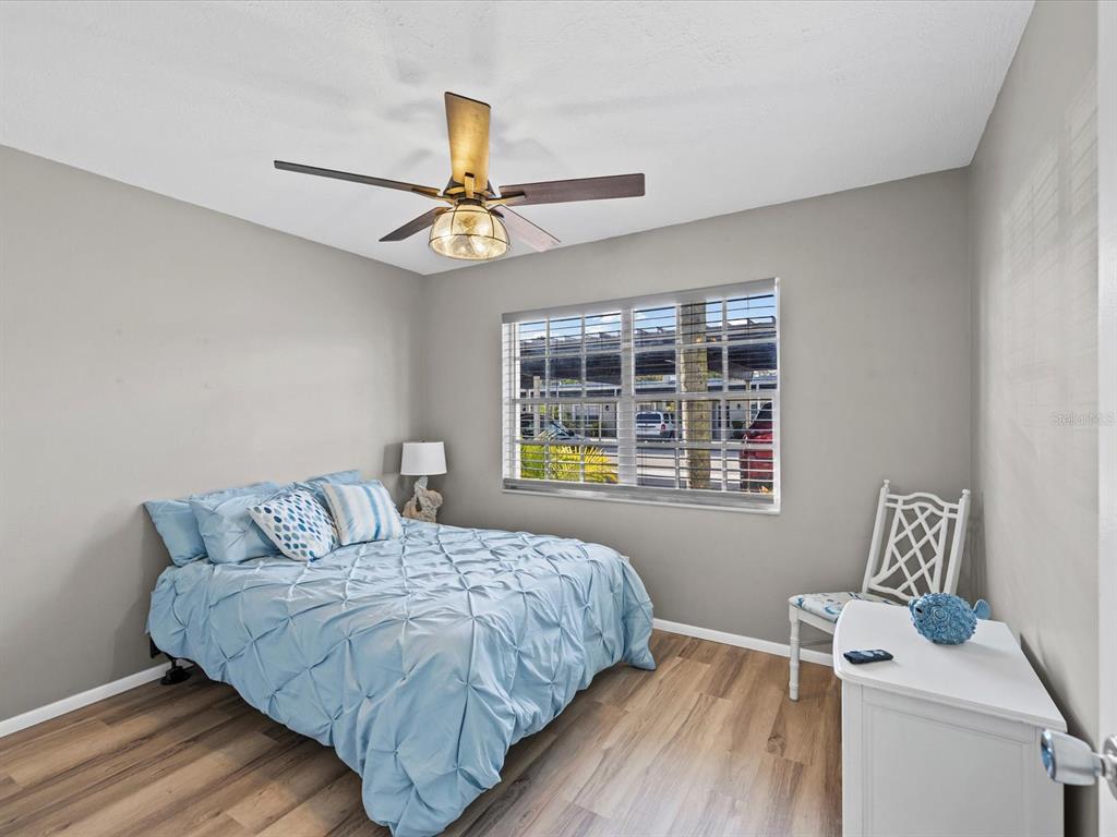 3717 Trophy Boulevard New Port Richey, FL 34655 - Photo 15 of 35 a bedroom with a bed and a window