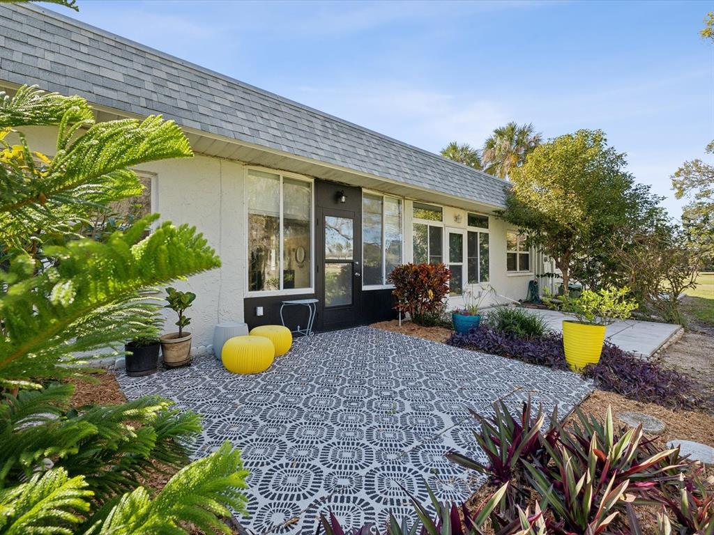 3717 Trophy Boulevard New Port Richey, FL 34655 - Photo 22 of 35 a view of a house with a backyard and sitting area