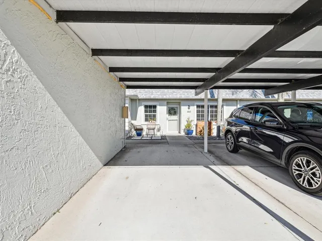 a view of a building with car parked