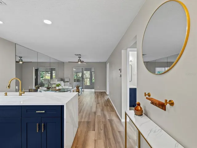 a en suite bathroom with a double vanity sink and a mirror
