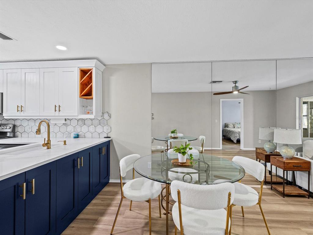 3717 Trophy Boulevard New Port Richey, FL 34655 - Photo 8 of 35 a living room with furniture a dining table and kitchen view