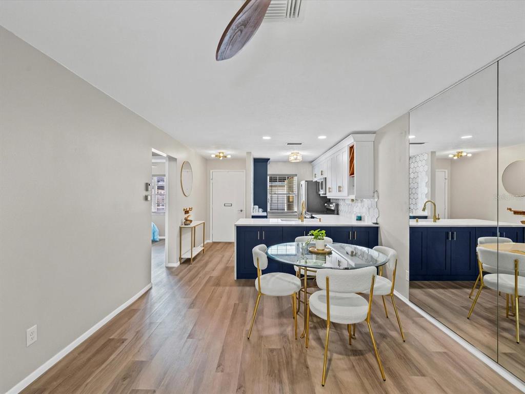 3717 Trophy Boulevard New Port Richey, FL 34655 - Photo 9 of 35 a living room with furniture and a wooden floor