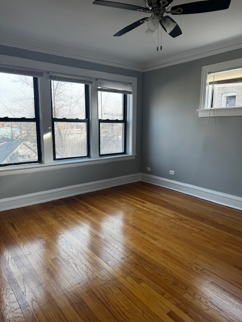 1614 North Harding Avenue, Unit 3E Chicago, IL 60647 - Photo 11 of 14 a view of empty room with wooden floor and fan
